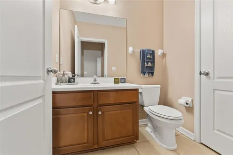 a bathroom with a sink toilet and mirror