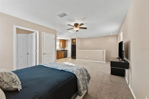 a living room with furniture and a lamp