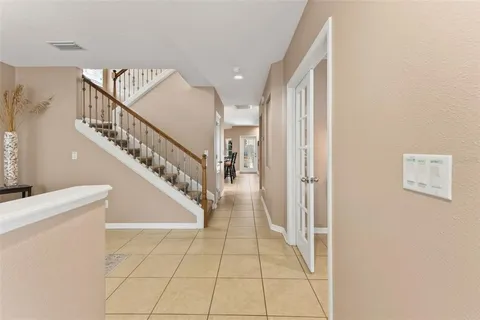 a view of entryway and hall with a front door