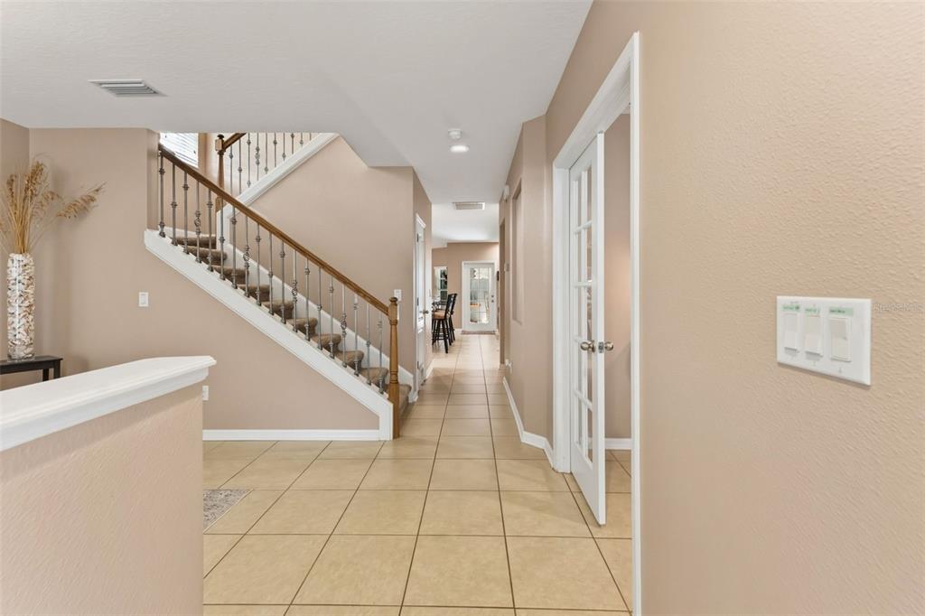 6058 Fishhawk Crossing Boulevard Lithia, FL 33547 - Photo 30 of 47 a view of entryway and hall with a front door