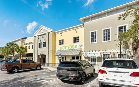 a front view of a house with parking space