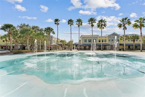 a view of a swimming pool with an outdoor seating