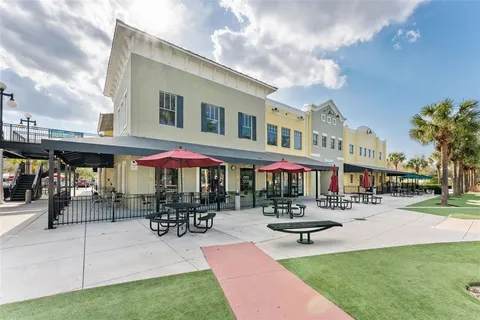 a front view of a building with sitting area