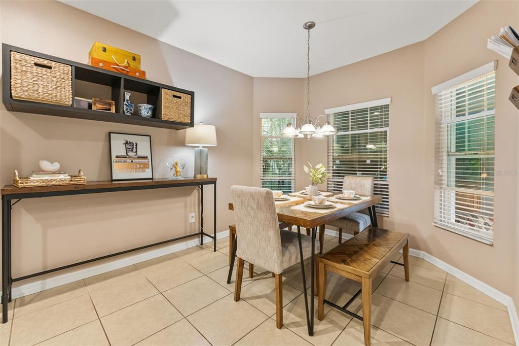 6058 Fishhawk Crossing Boulevard Lithia, FL 33547 - Photo 7 of 47 a view of a dining room with furniture window and outside view