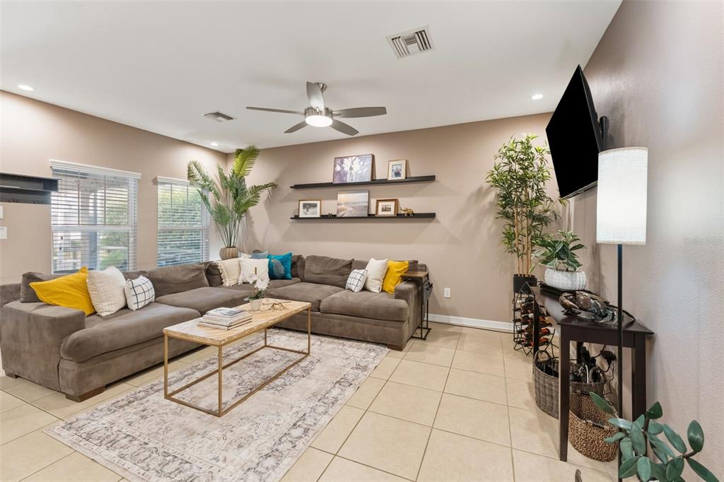 6058 Fishhawk Crossing Boulevard Lithia, FL 33547 - Photo 9 of 47 a living room with furniture and a large window