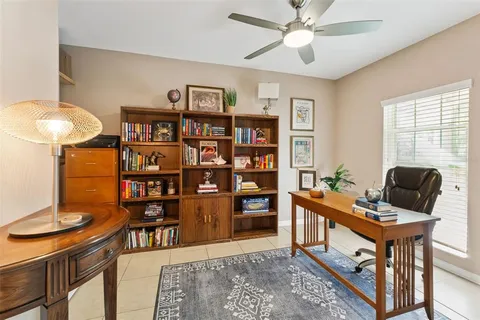 a workspace with furniture window and wooden floor