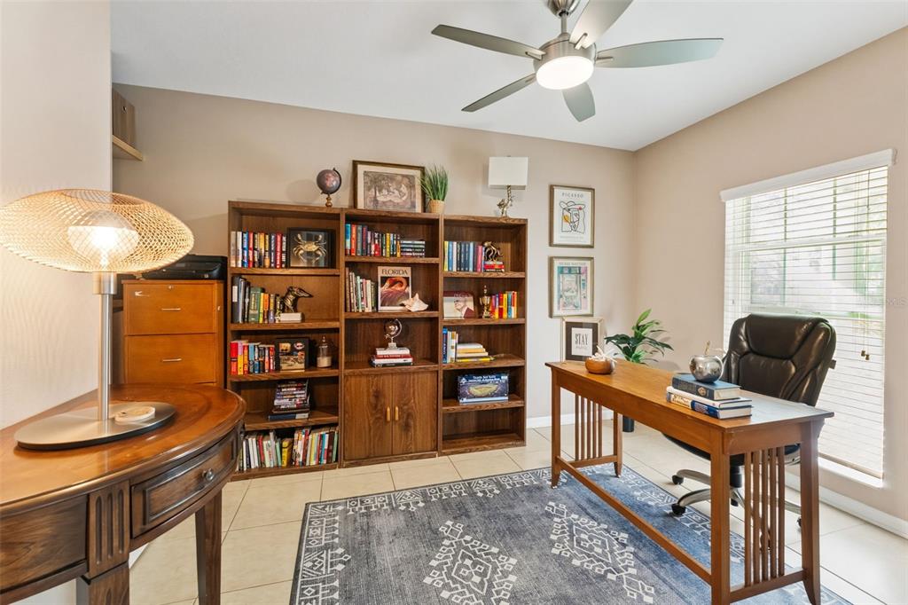 6058 Fishhawk Crossing Boulevard Lithia, FL 33547 - Photo 10 of 47 a workspace with furniture window and wooden floor
