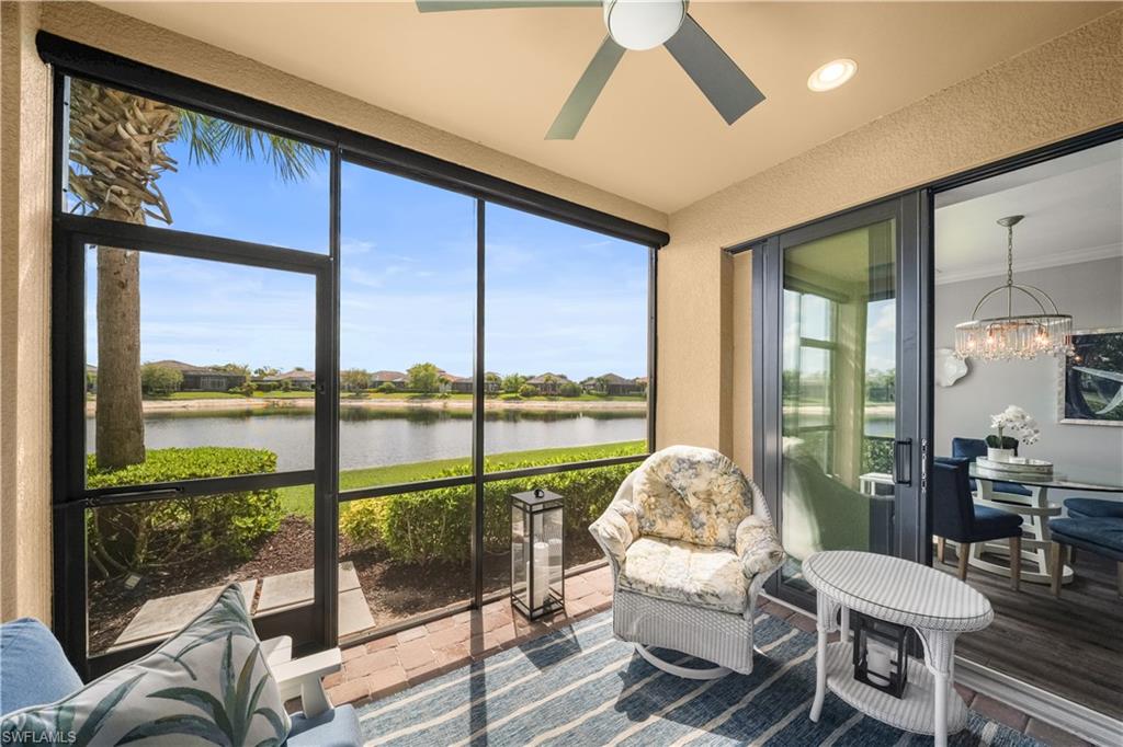 9685 Montelanico Loop, Unit 101 Naples, FL 34119 - Photo 14 of 49 a balcony with furniture and large windows