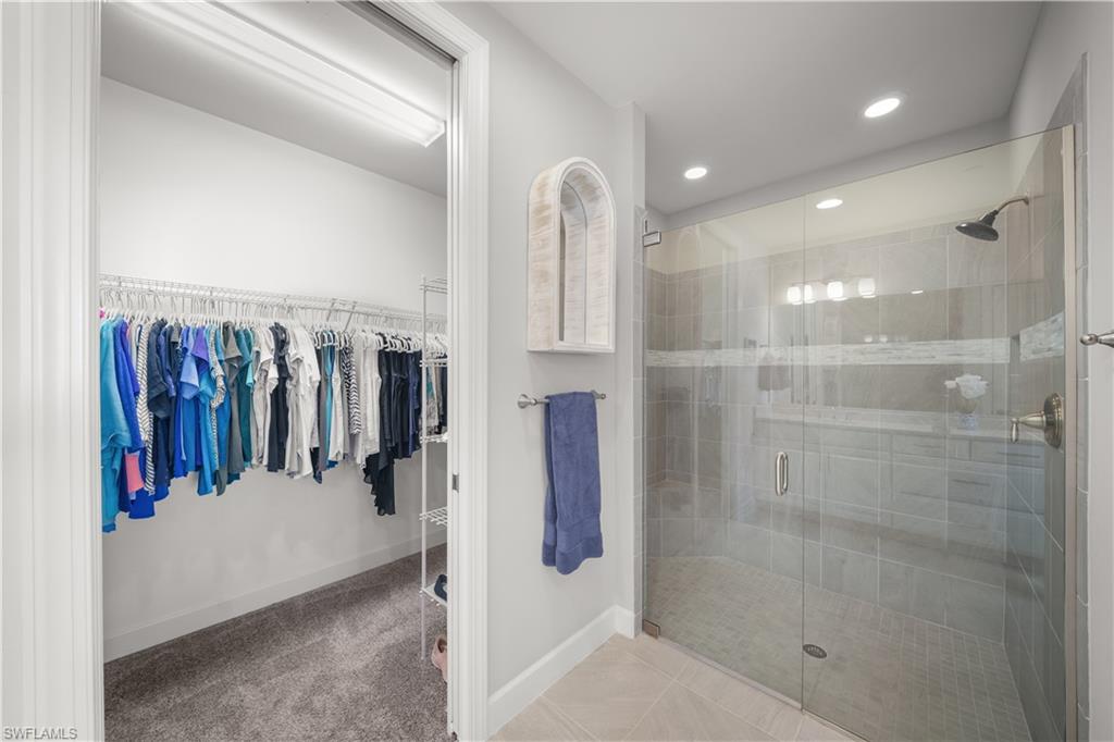 9685 Montelanico Loop, Unit 101 Naples, FL 34119 - Photo 21 of 49 a view of a walk in closet