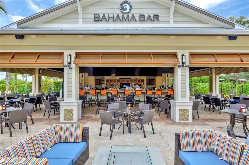 9685 Montelanico Loop, Unit 101 Naples, FL 34119 - Photo 38 of 49 a view of a dining room with furniture window and outside view