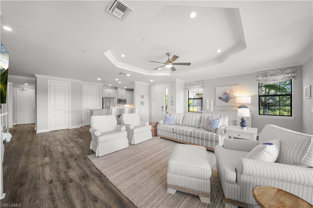 9685 Montelanico Loop, Unit 101 Naples, FL 34119 - Photo 5 of 49 a living room with furniture and a large window