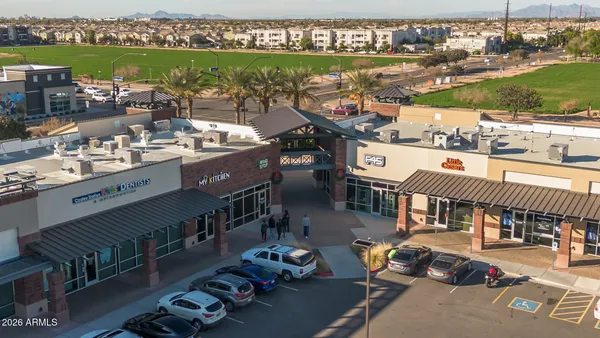 an aerial view of residential building and lake
