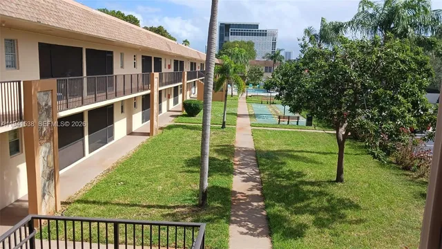 a view of house with a yard