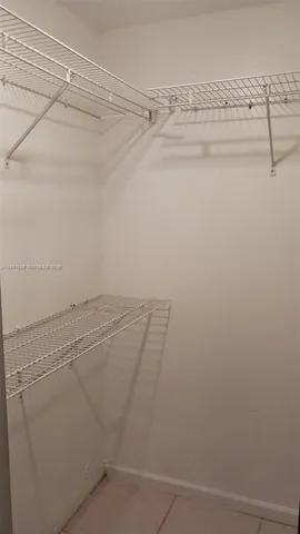 a view of a room with racks on the wall