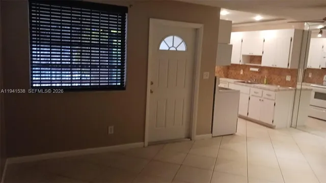 a bathroom with a sink a mirror and a shower
