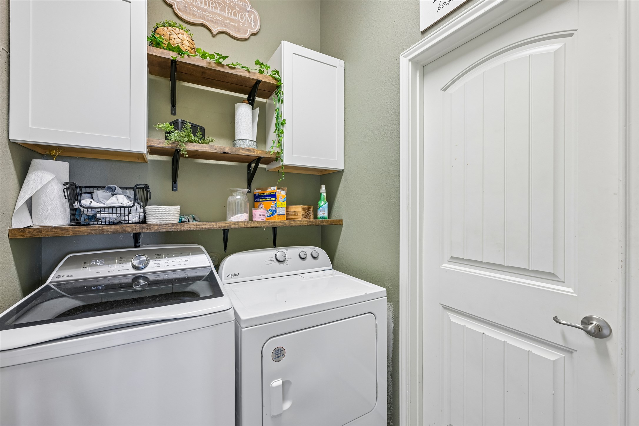 1297 Harwell Loop Kyle, TX 78640 - Photo 30 of 39 Ample shelving and modern appliances enhance this dedicated laundry space.