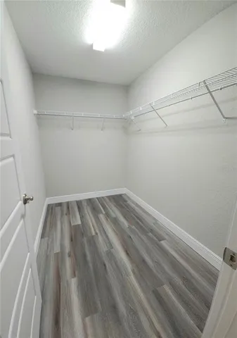 a view of a room with racks on the wall