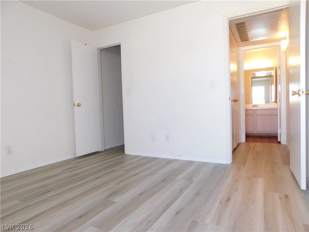 5221 South Lindell Road, Unit 202 Las Vegas, NV 89118 - Photo 22 of 28 The light-toned wood plank flooring provides a neutral and clean foundation for this comfortable room.