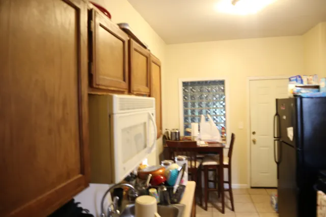 a view of a dining room with furniture and window