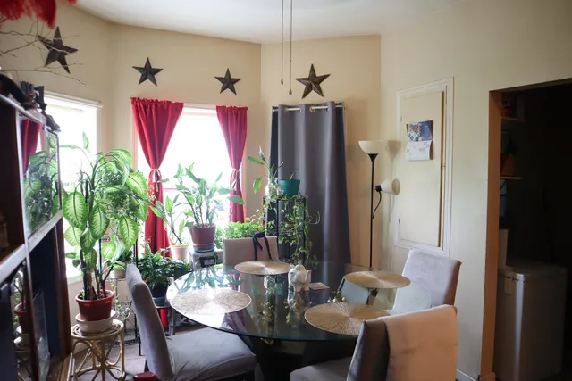 a view of a dining room with furniture window and outside view