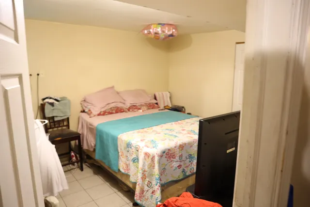 a bedroom with a bed and a table