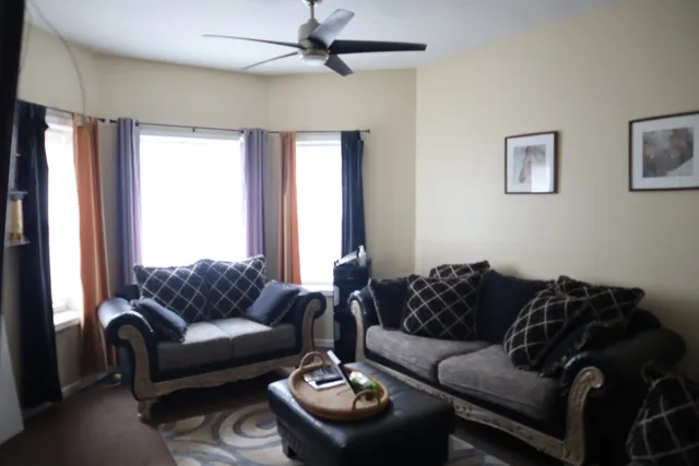 a living room with furniture and a window
