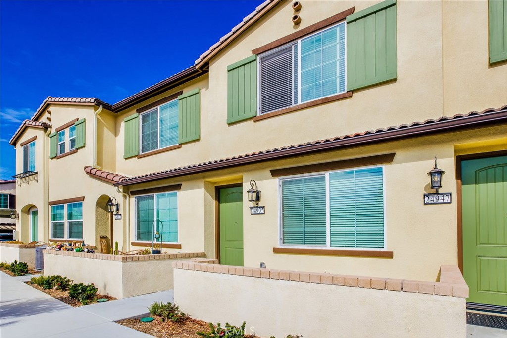 24935 Vermijo Court Wildomar, CA 92595 - Photo 1 of 26 a front view of a house with a yard