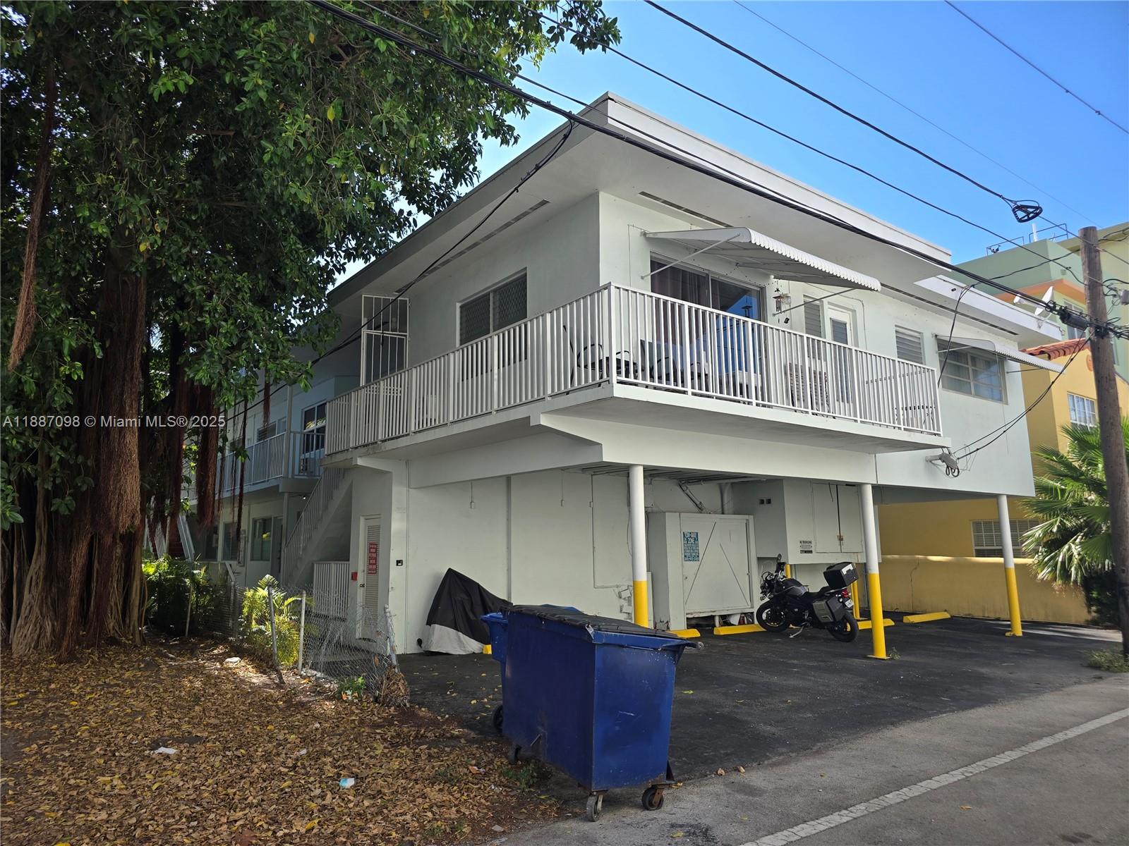 835 Meridian Avenue, Unit 4 Miami Beach, FL 33139 - Photo 12 of 12 a front view of a house with many windows
