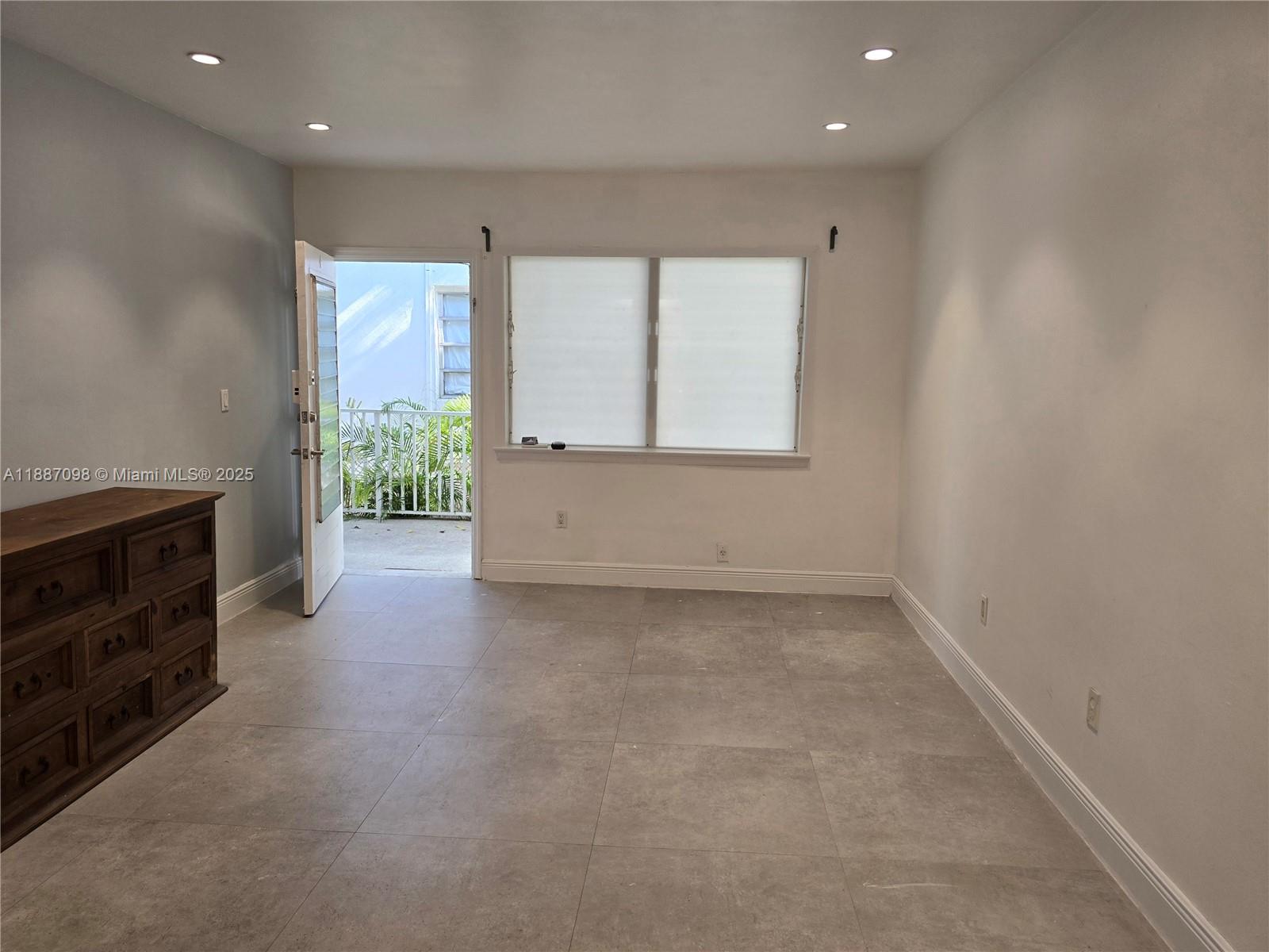 835 Meridian Avenue, Unit 4 Miami Beach, FL 33139 - Photo 3 of 12 an empty room with windows