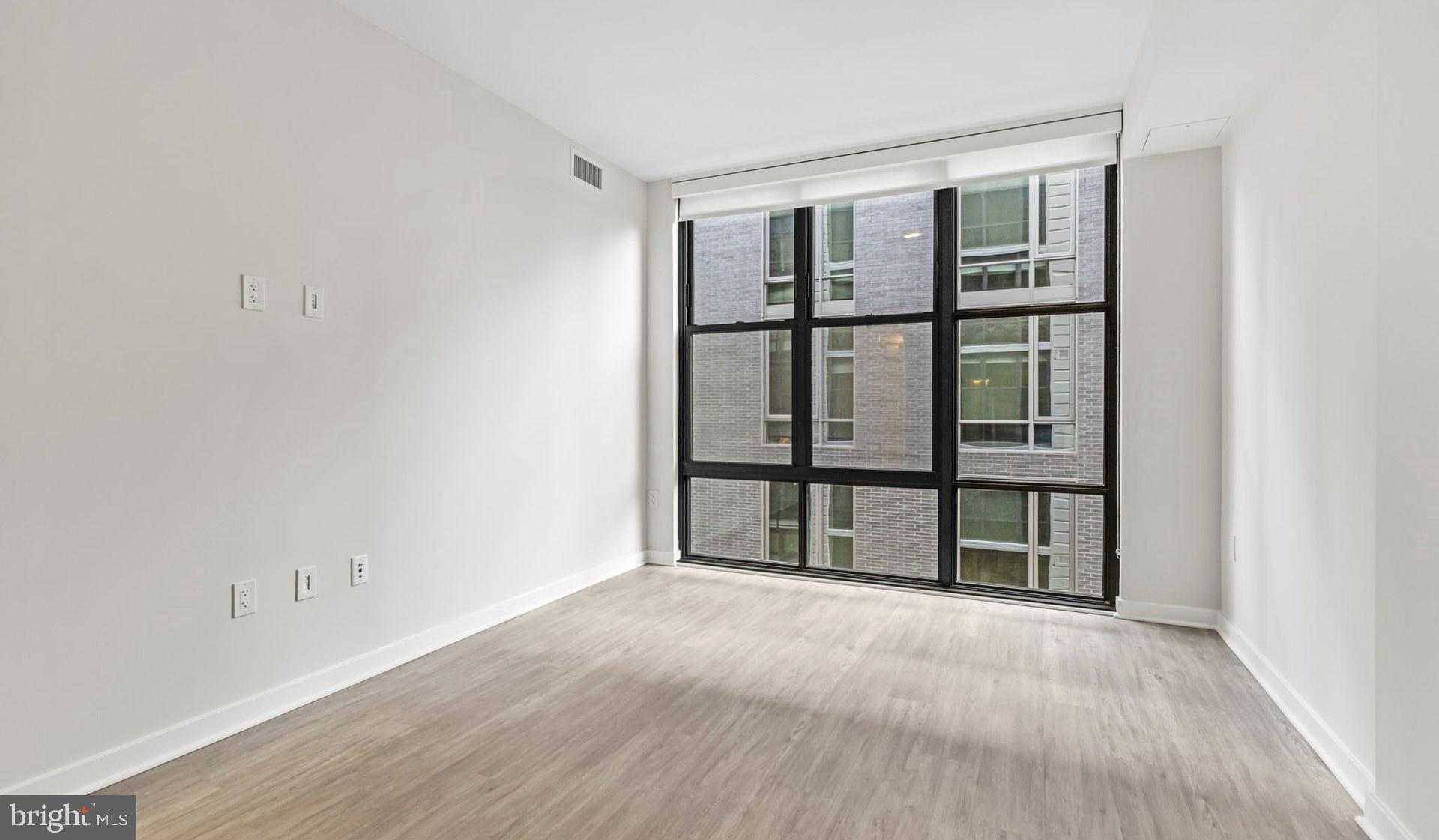 4000 Wisconsin Avenue Northwest, Unit 4K236 Washington, DC 20016 - Photo 20 of 54 a view of empty room with windows