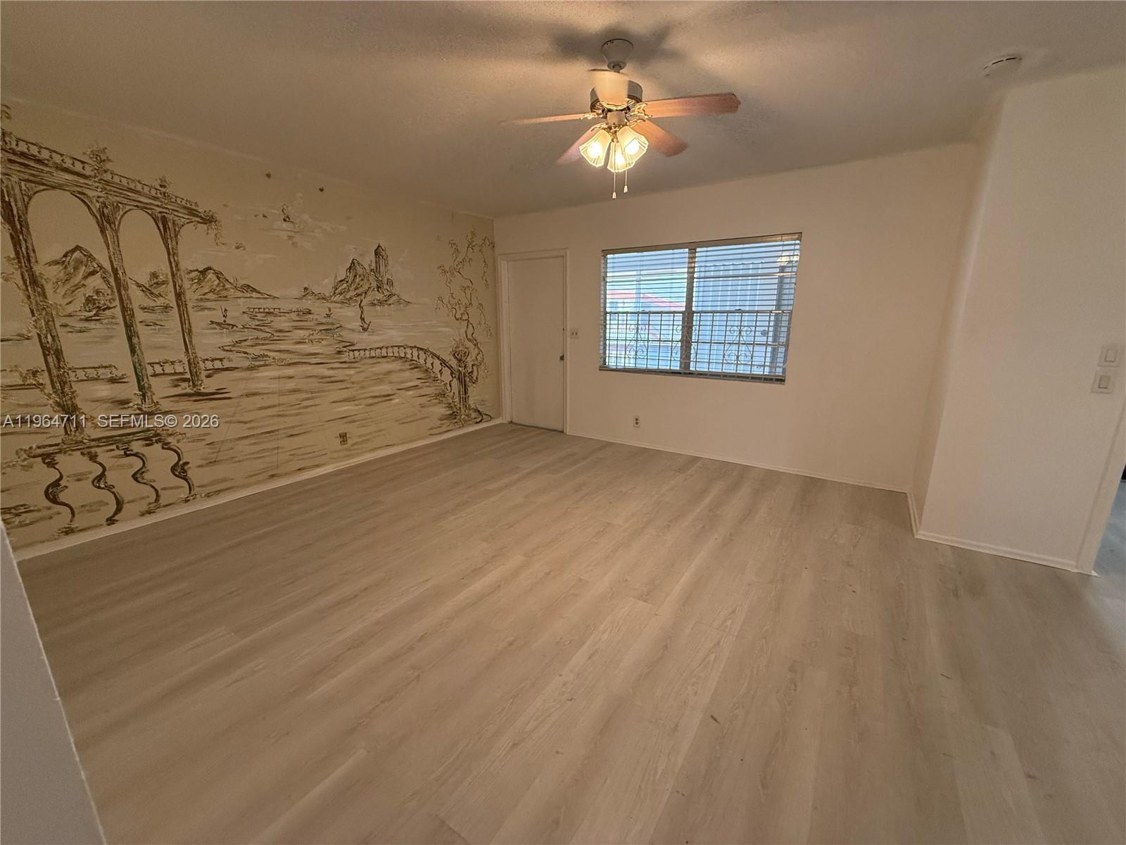 5300 Washington Street, Unit B329 Hollywood, FL 33021 - Photo 1 of 20 an empty room with windows