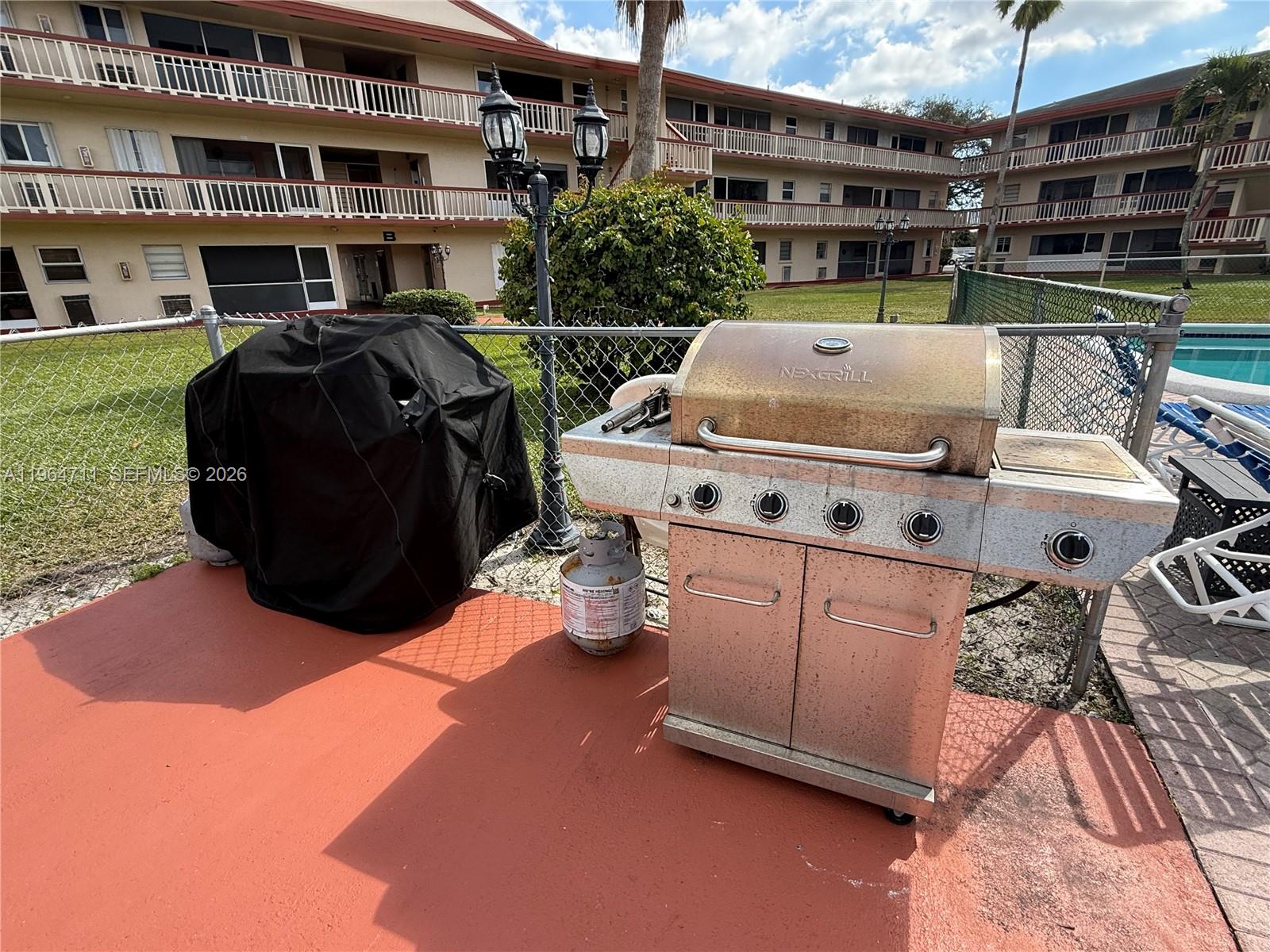 5300 Washington Street, Unit B329 Hollywood, FL 33021 - Photo 17 of 20 a roof deck with couch and potted plants