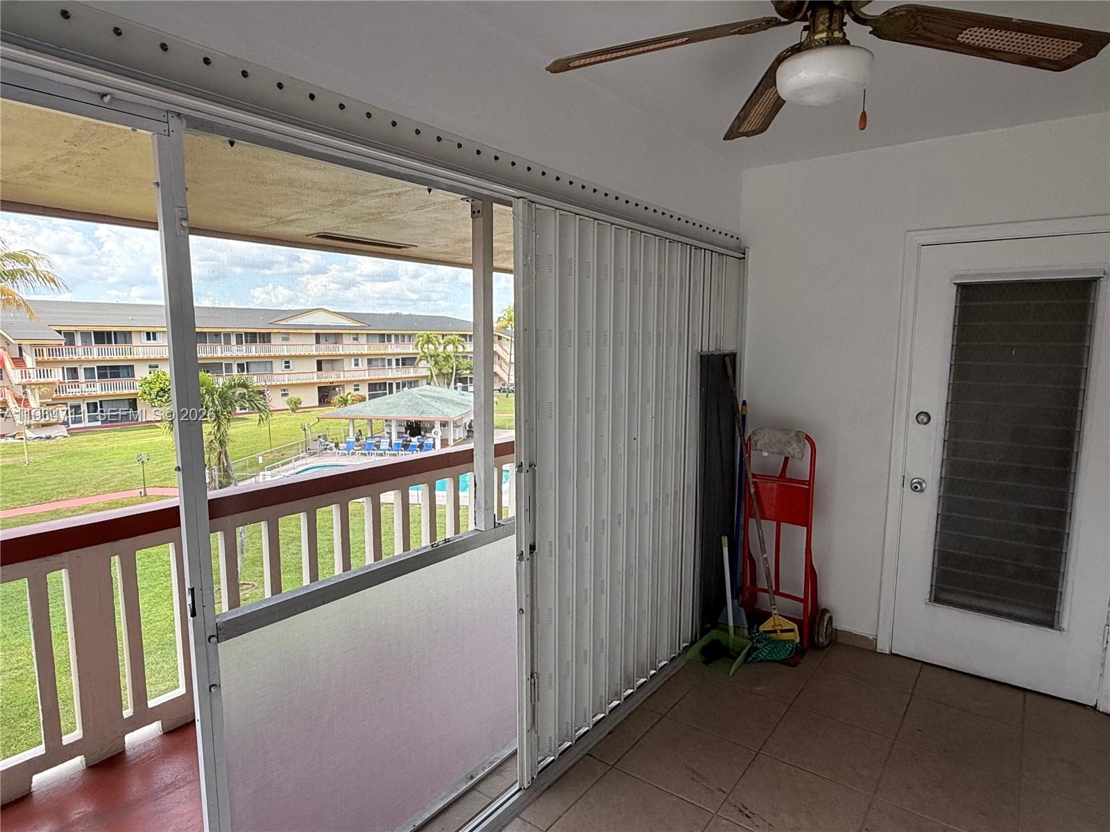 5300 Washington Street, Unit B329 Hollywood, FL 33021 - Photo 10 of 20 a view of a porch with a floor to ceiling window