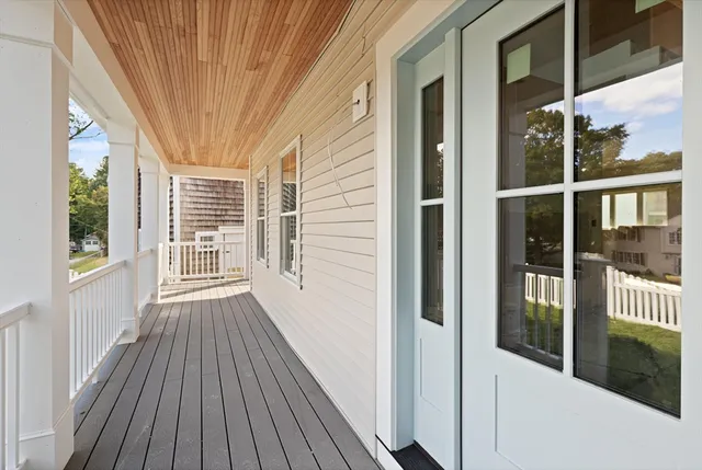 a view of outdoor space with wooden floor