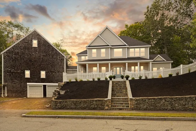 a front view of a house with yard