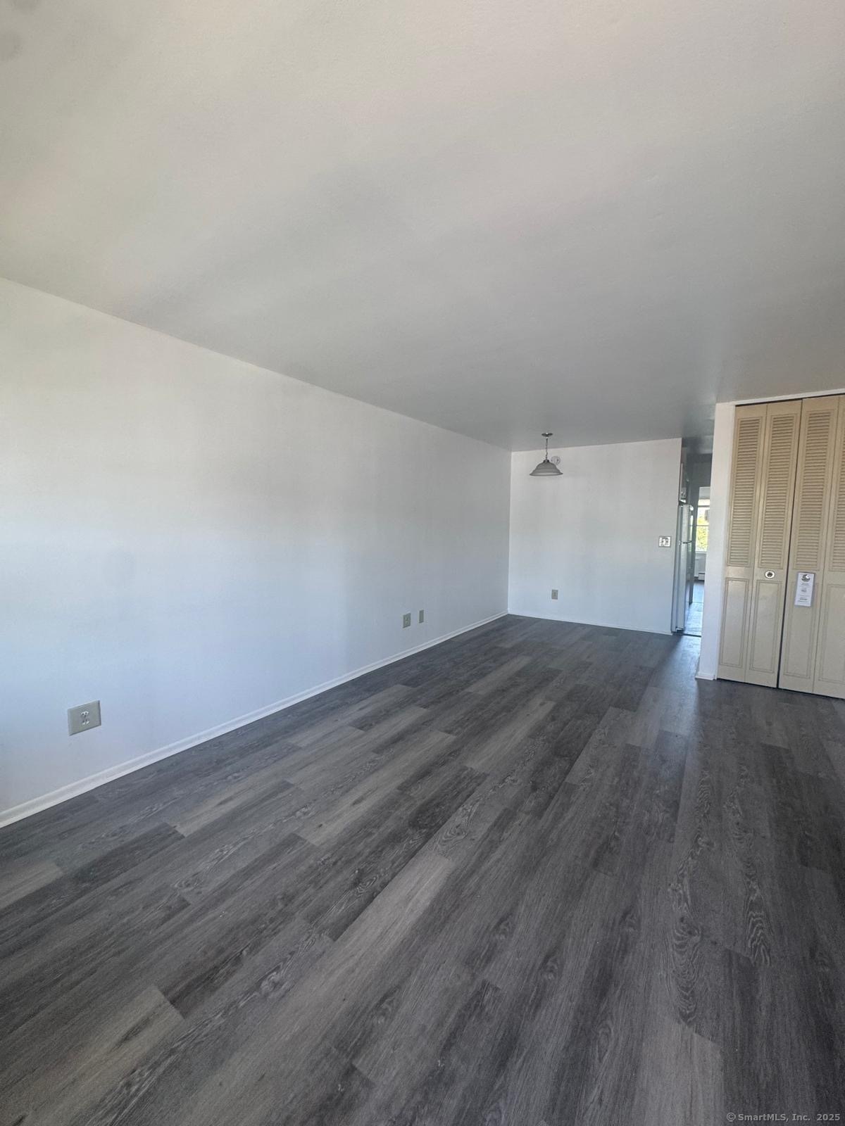 169 Birdseye Street, Unit C2 Bridgeport, CT 06604 - Photo 5 of 10 wooden floor in a empty room