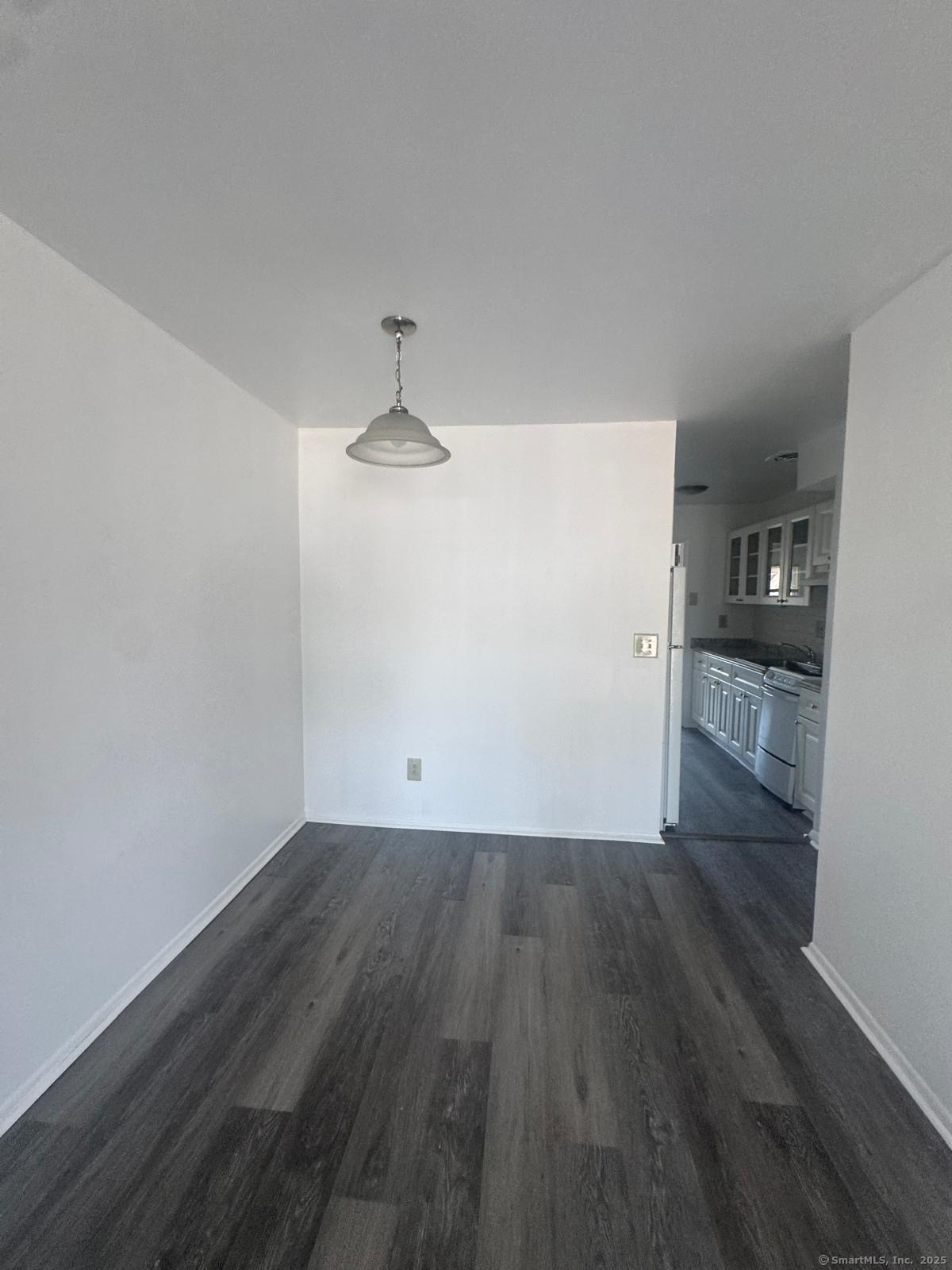 169 Birdseye Street, Unit C2 Bridgeport, CT 06604 - Photo 6 of 10 a view of empty room with wooden floor