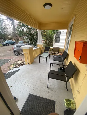 a living room with patio furniture