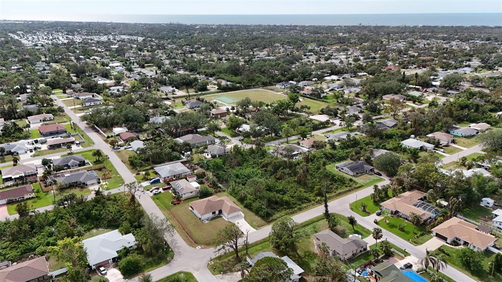 3112 Cypress Road Venice, FL 34293 - Photo 4 of 5 an aerial view of a city with lots of residential buildings