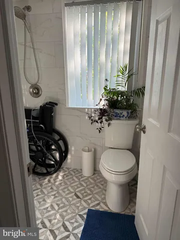 a bathroom with a toilet and a sink
