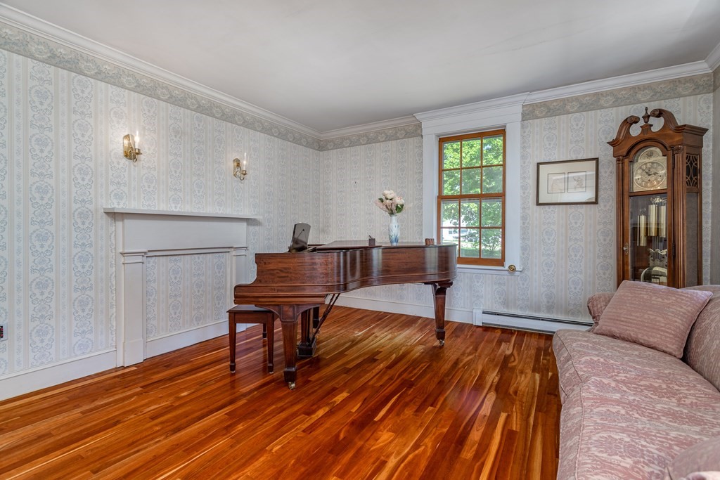 5 Lancaster Road Shirley, MA 01464 - Photo 11 of 42 a living room with furniture and a wooden floor