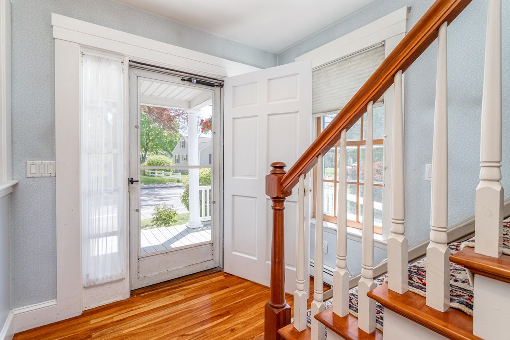 5 Lancaster Road Shirley, MA 01464 - Photo 14 of 42 a view of an entryway with wooden floor and windows