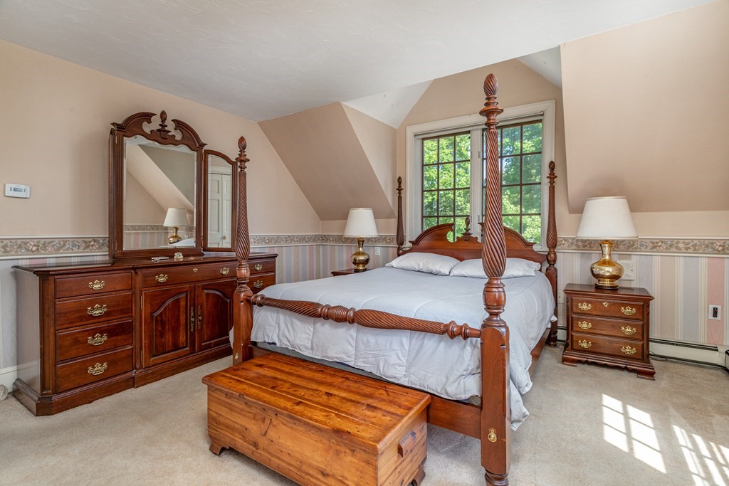 5 Lancaster Road Shirley, MA 01464 - Photo 18 of 42 a bed room with a bed and a dresser