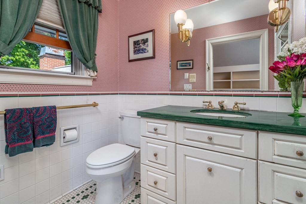 5 Lancaster Road Shirley, MA 01464 - Photo 19 of 42 a bathroom with a toilet a sink and mirror