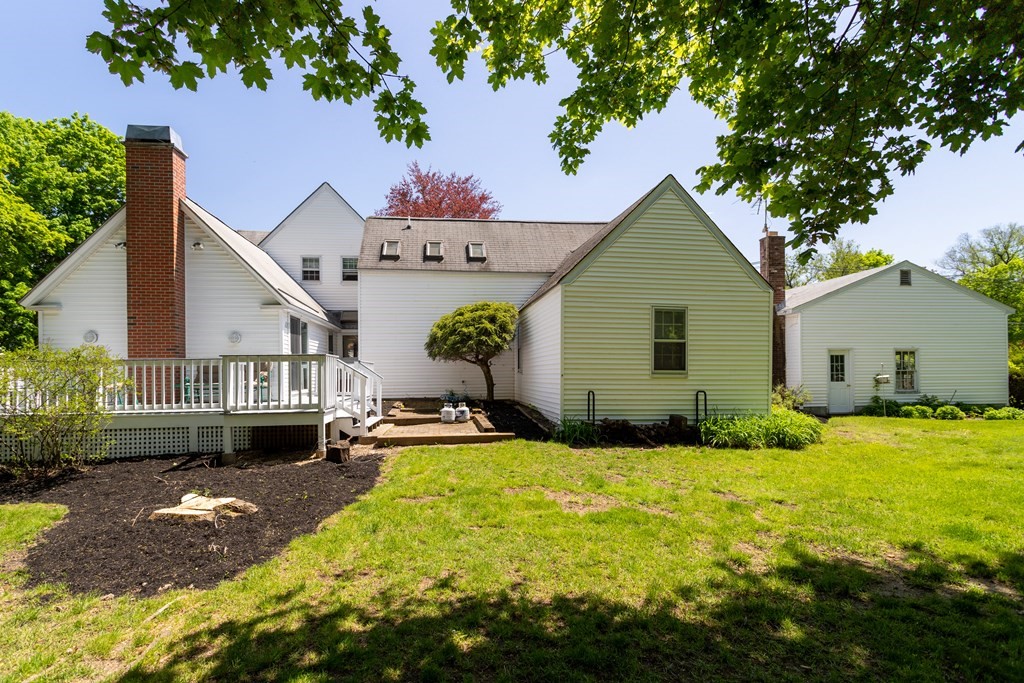 5 Lancaster Road Shirley, MA 01464 - Photo 2 of 42 a view of a house with a yard and potted plants
