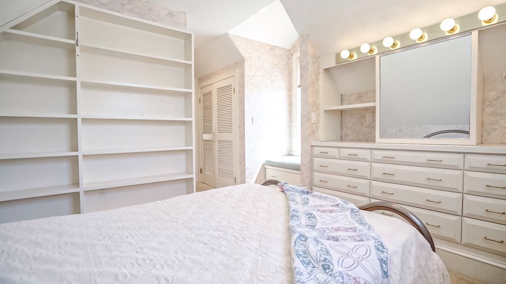 5 Lancaster Road Shirley, MA 01464 - Photo 24 of 42 a bedroom with a bed and a window