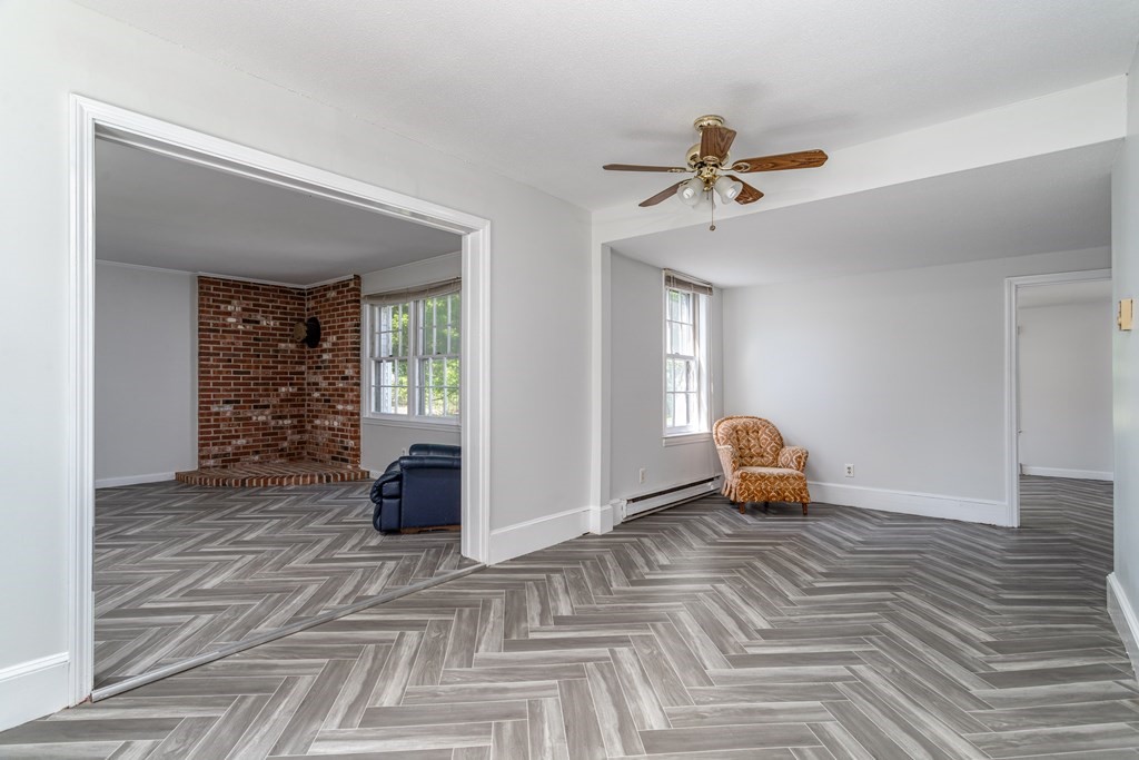 5 Lancaster Road Shirley, MA 01464 - Photo 28 of 42 a view of a livingroom with wooden floor and a ceiling fan