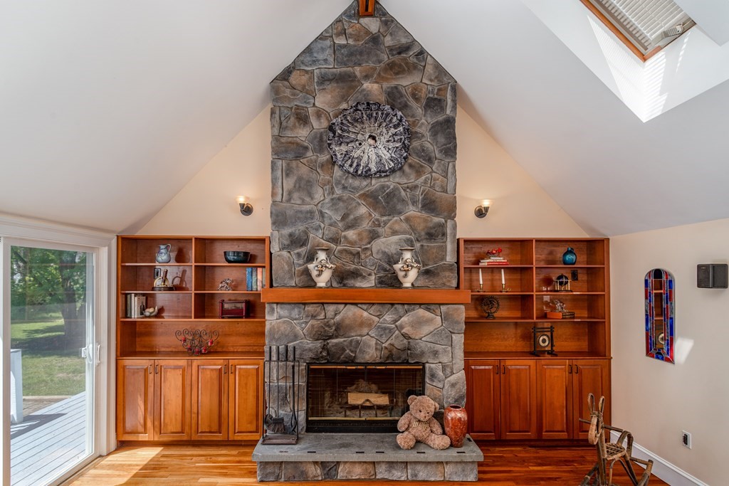 5 Lancaster Road Shirley, MA 01464 - Photo 3 of 42 a living room with stainless steel appliances furniture a rug and a fireplace