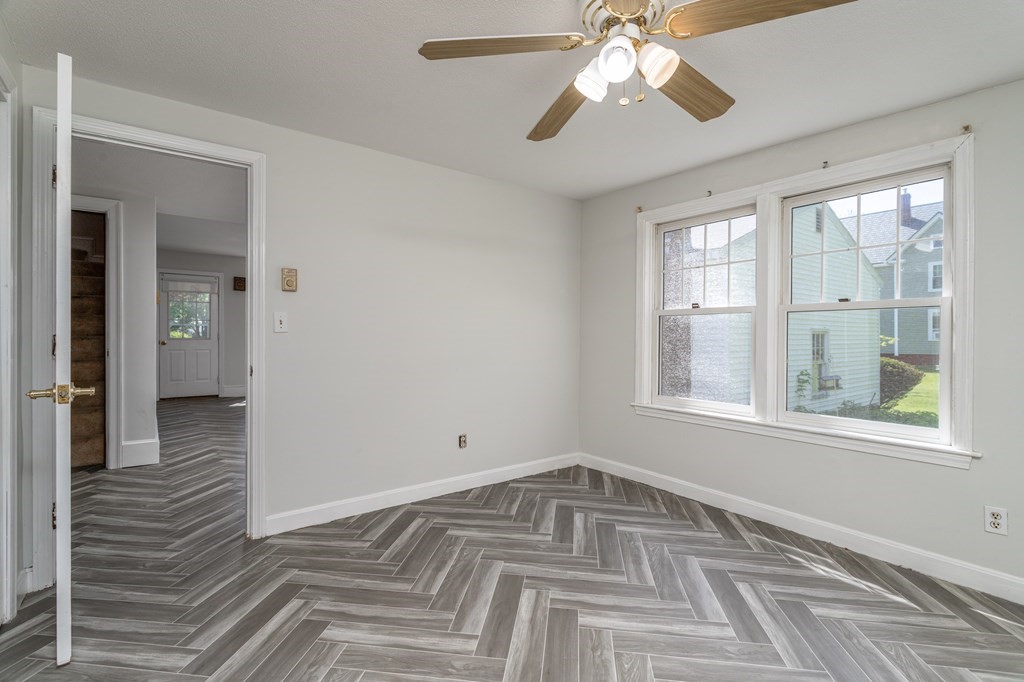 5 Lancaster Road Shirley, MA 01464 - Photo 33 of 42 a view of an empty room with wooden floor and a window
