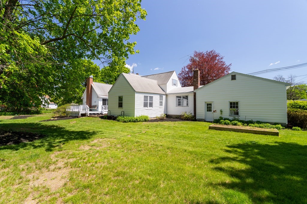 5 Lancaster Road Shirley, MA 01464 - Photo 40 of 42 a front view of a house with a yard and garage